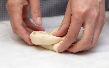 The hostess prepares the pies in the kitchen