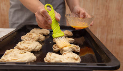 The hostess prepares the pies in the kitchen
