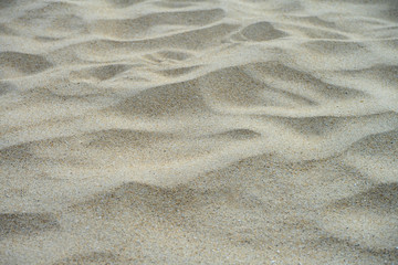 closeup of sand pattern of a beach in the summer