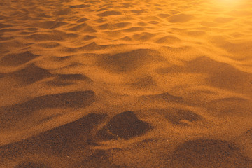 closeup of sand pattern of a beach in the summer