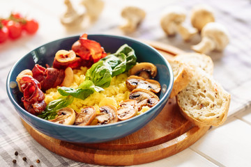 Polenta Italian Corn Porridge Cooked Pork Bacon. Traditional Healthy Breakfast with Mushroom in Bowl Close-up Side View. Yellow Cornmeal Gourmet Serving with Salad Leaf and Bread Ingredient