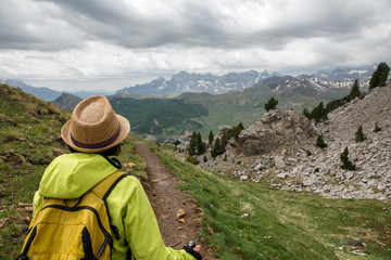 Fototapeta na wymiar hiker woman with view of Tena Valley in The Pyrenees, Formigal, Huesca, Spain