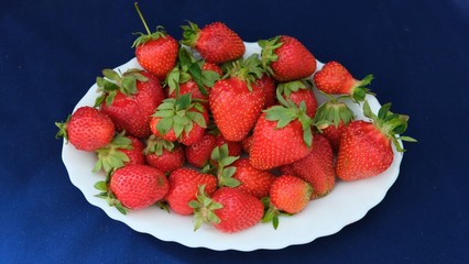 ripe strawberry on a blue background