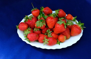 ripe strawberry on a blue background