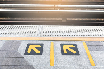 arrow symbol on platform sky train
