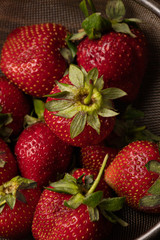 strawberries: closeup on dark background