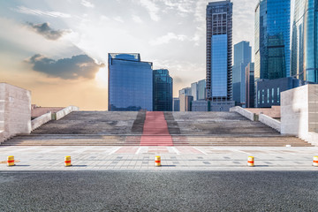 Panoramic skyline and modern business office buildings with empty road,empty concrete square floor