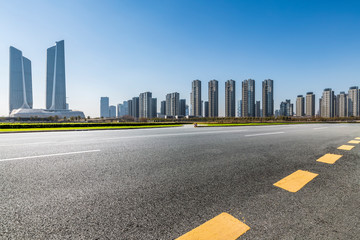 Panoramic skyline and modern business office buildings with empty road,empty concrete square floor