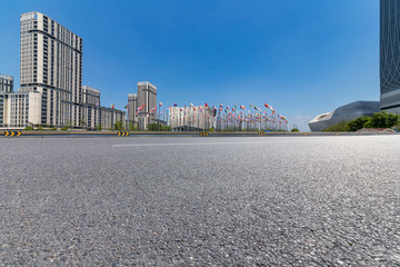 Panoramic skyline and modern business office buildings with empty road,empty concrete square floor