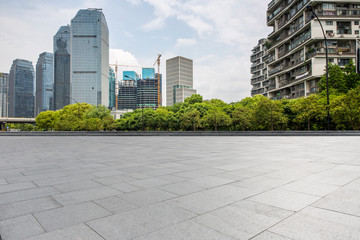 Panoramic skyline and modern business office buildings with empty road,empty concrete square floor