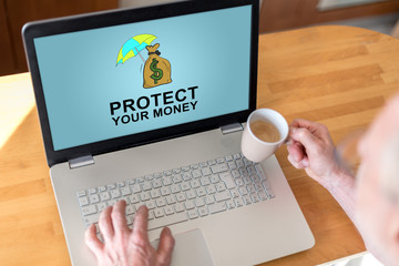 Money protection concept on a laptop