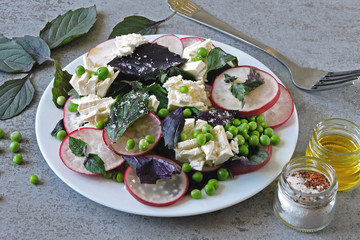 Healthy dietary salad with green peas, radish and white cheese. Keto diet. Keto Salad