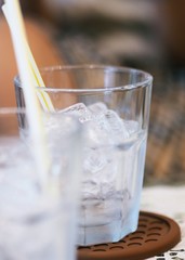 Glass of water with ice closeup macro