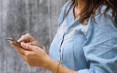 Woman with mobile phone closeup