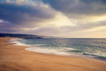 Sunset over the sea. Atlantic ocean in the evening. Nazare, Portugal, Europe