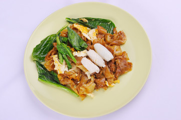 Stir-fried Noodles with pork and chinese broccoli in Sweet Soy Sauce on white background