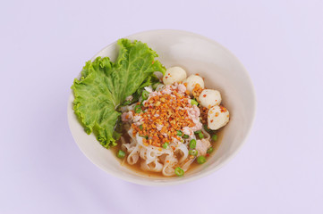 Spicy tom yum noodles with pork, thai noodles, Tom yum pork noodles soup on white background