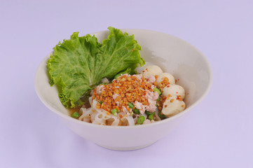 Spicy tom yum noodles with pork, thai noodles, Tom yum pork noodles soup on white background