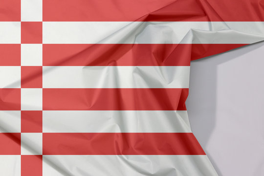 Fabric Bremen flag crepe and crease with white space, a red and white flag.