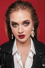 Fototapeta na wymiar Image of glamorous young woman 20s with bright makeup wearing earrings posing at camera