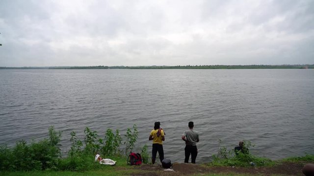 Two fishermen fishing by the Ambazari lake