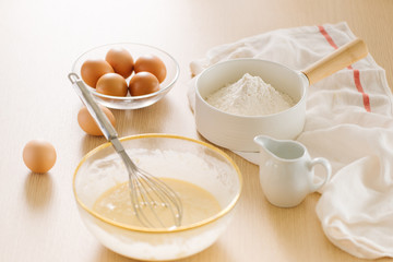 Ingredients and tools for baking sweet cake with banana and almonds