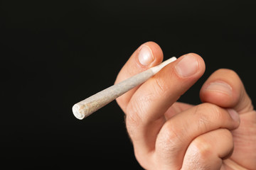 Man smokeing cannabis joint