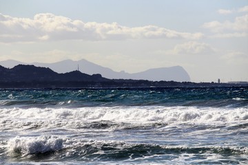 rescue boat on the beach with cape in the background