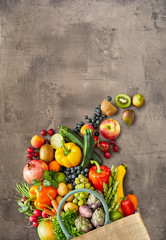 Fruits and vegetables spilled from canvas bag