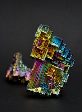 Bismuth crystals on a dark background. This is the most strongly diamagnetic element and also the heaviest that is not radioactive.