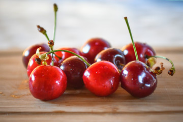 Large collection of fresh red cherries served on a table