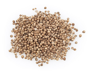 Heap of dried coriander seeds isolated on white background