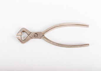 Old sugar cutters on a light background