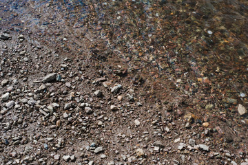 Stone river bank. Gray earth texture