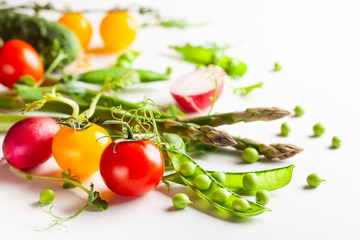Fresh green  peas pods, radish, green asparagus, tomatoes
