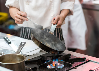 Chef cooking food in the kitchen, Chef preparing food
