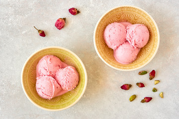 Strawberry rosewater ice cream , frozen yogurt with pistachio and rosebud. Top view	