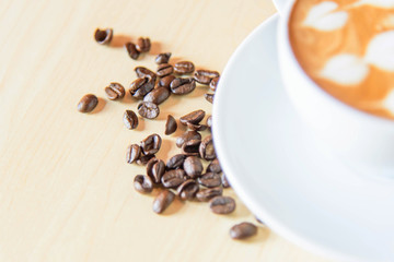 coffee bean near coffee cup