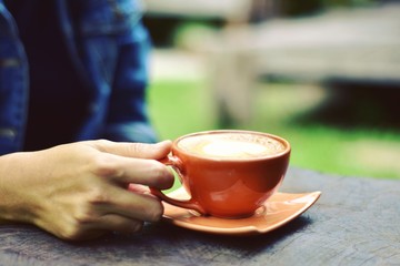 Women are drinking hot coffee in the morning.