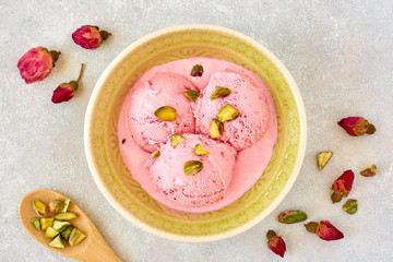 Strawberry rosewater ice cream , frozen yogurt with pistachio and rosebud. Top view	