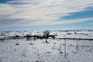 Murgia plateau countryside winter landscape covered by snow. Apulia region, Italy.