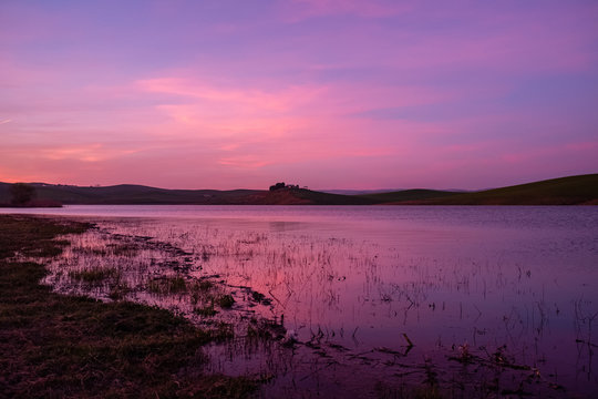 Sunset over the artificial lake of Serra del Corvo. Apulia and Basilicata regions, Italy