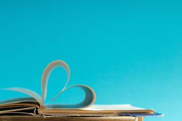 Old hard cover book page decorate to heart shape for love in val