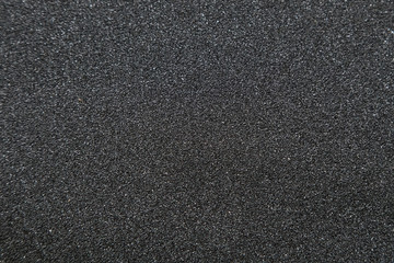 Close up of of skateboard grip tape. Macro photograph of sandpap