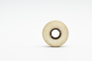 Close up of a skateboard wheel on white background. Complete ska