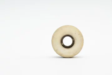  Close up of a skateboard wheel on white background. Complete ska © CrispyMedia