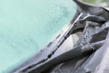 Ice flowers, frozen car window.The ice-cold frost forms ice crys