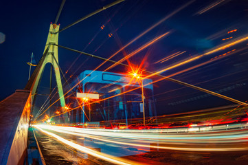 Fototapeta na wymiar Night traffic on the bridge.
