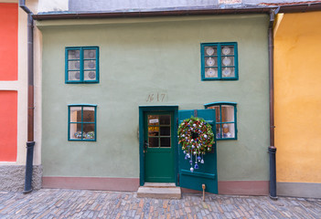 Prague, Czech Republic-February 01, 2019. House of Golden Lane, street situated in Prague Castle with small houses. They were inhabited by defenders of the Castle, many of them are now souvenir shops.