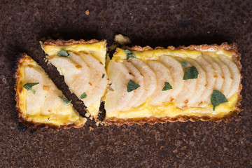  Pear tart with  pecan nuts  and custard cream, top view, flat lay , vertical composition